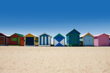 Fototapeta  - Bright and colorful houses on white sand beach