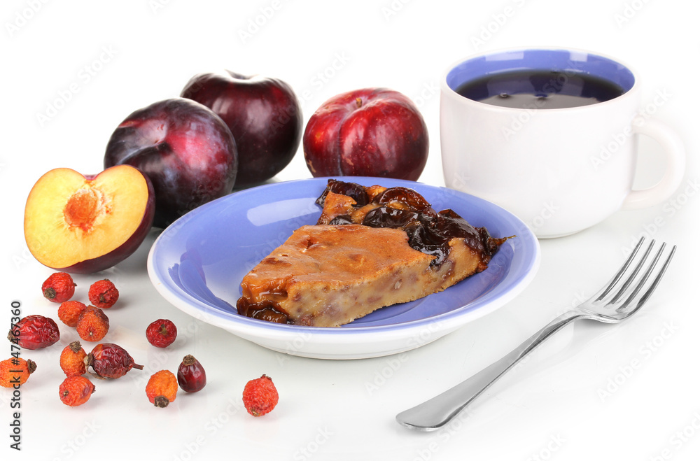 Tasty pie on blue plate with plums isolated on white
