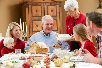 Wall Mural - Multi Generation Family Celebrating With Christmas Meal