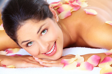 Wall Mural - Young woman getting massage in spa salon.