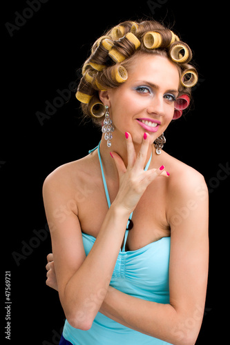 Fototapeta na wymiar woman with hair curlers