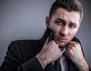 Elegant young handsome man. Studio fashion portrait.