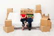 © Ilike - Couple in their new home with cardboard boxes