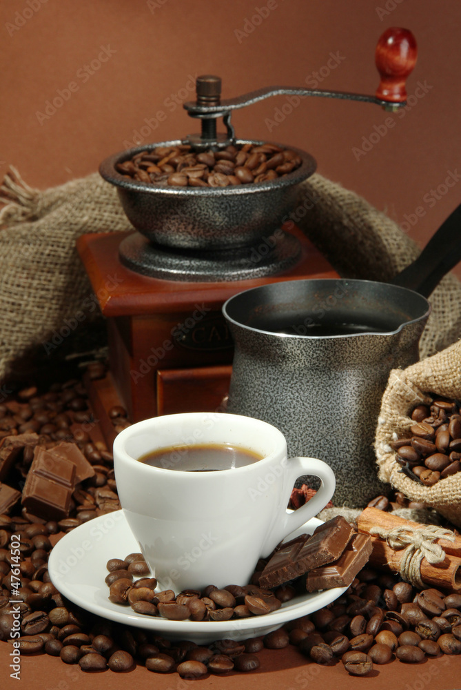 cup of coffee, grinder, turk and coffee beans