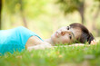 © artemisphoto - Lying on grass