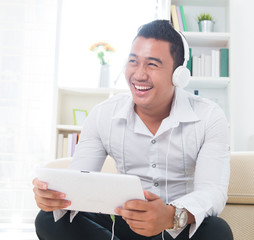 Wall Mural - Asian man listen music with headphone