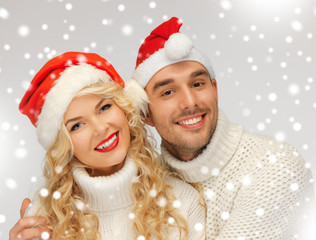 Wall Mural - family couple in sweaters and santa's hats