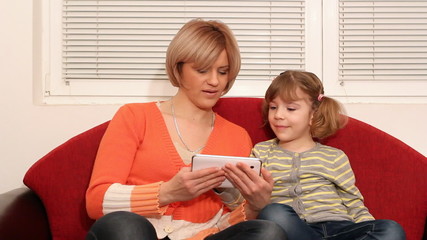 Wall Mural - mother and daughter play with tablet