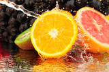 Fototapeta Łazienka - Pure fruit in a spray of water