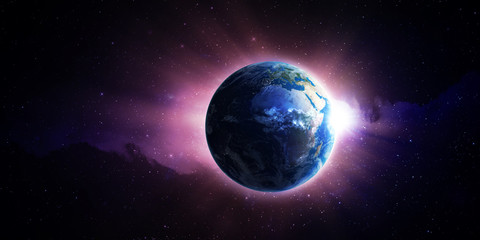 Wall Mural - sun rising over earth