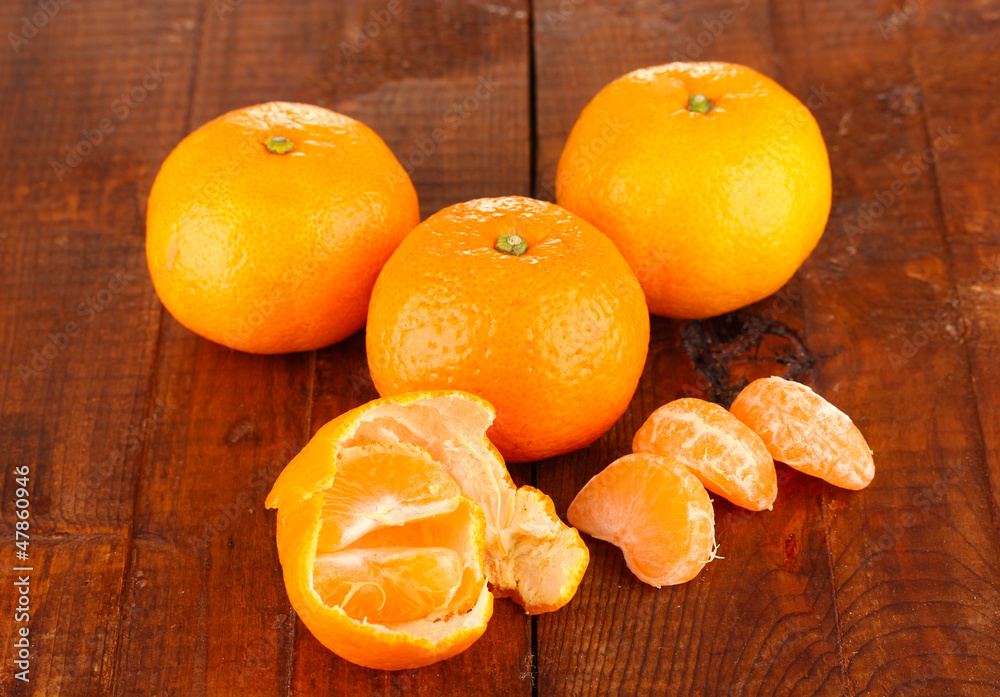Tasty mandarines  on wooden background