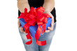 blue gift box with red ribbon in woman hands