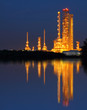 Reflection of gold petrochemical industry on sunset