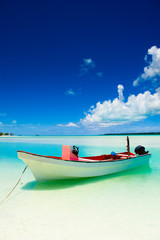 Wall Mural - Beautiful Tropical Lagoon with boat in foreground