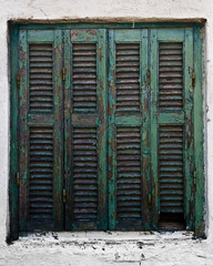 Fototapete - Wooden turquoise window on a white house in Sarti, Greece