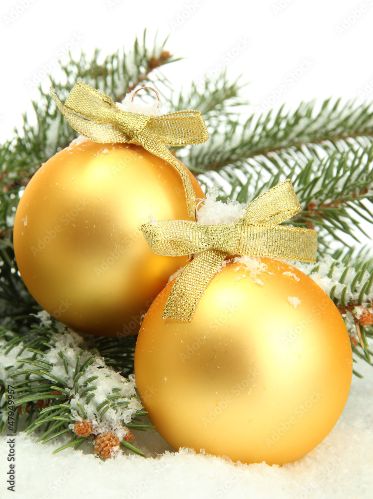 Christmas balls on fir tree with snow, isolated on white
