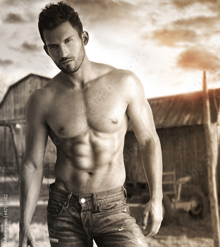 Obraz w ramie Sepia toned portrait of a hunky male model