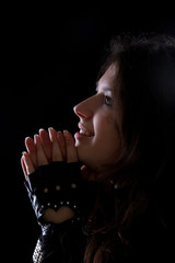 Portrait of a smiling praying girl