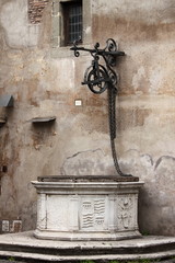 Canvas Print - Medieval water well in Rome, Italy