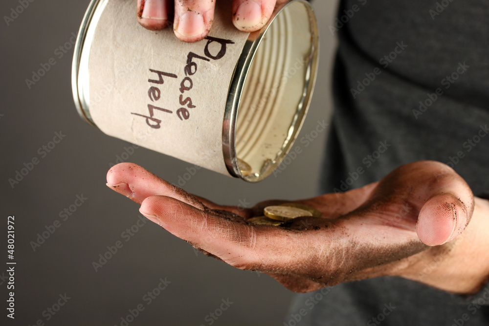 homeless pours money from bank, close-up
