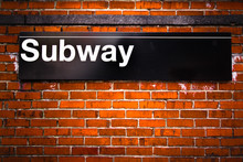 New York City Subway Sign Entrance On Brick Wall