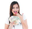 © iPortret - Excited Young Woman Holding Cash