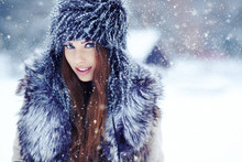 A Beauty Girl On The Winter Background