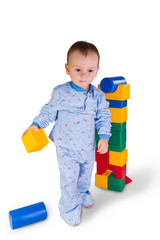 child playing with plastic blocks and cubes