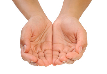 Beautiful cupped hands of young woman - cut out on white