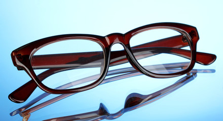 Poster - Beautiful glasses on blue background