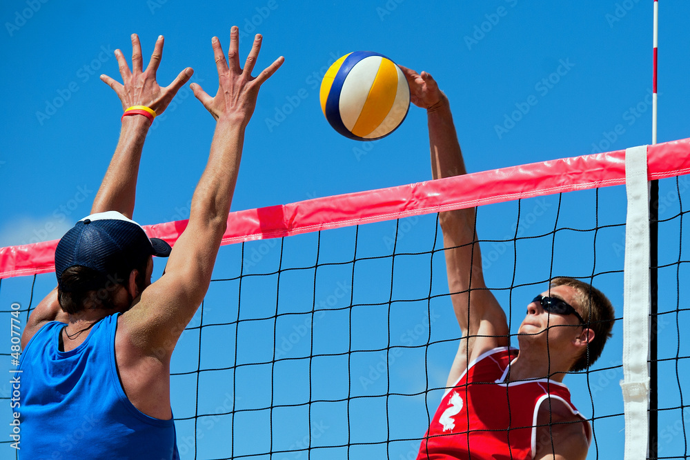 Beach volleyball tournament - attack and block - obrazy, fototapety, plakaty 