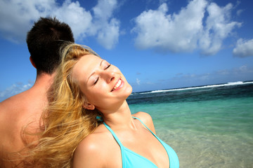 Blond girl relaxing on her boyfriend's back