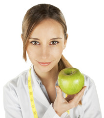  woman doctor with a green apple. Nutritionist