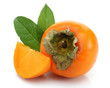 Slice persimmons with green leaves