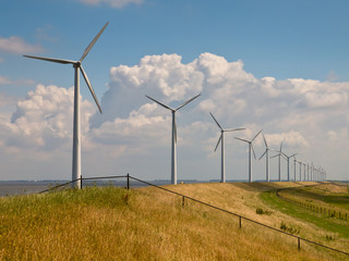  Row of wind turbines with fence