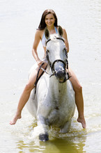 Equestrian On Horseback Riding Through Water