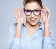 © ZoomTeam - business woman in glasses on sky background