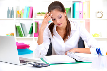 Wall Mural - Thoughtful business woman with notebook in office