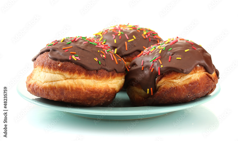 Tasty donuts on color plate isolated on white