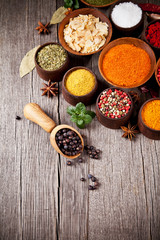 Wall Mural - Various kind of spices in wooden bowls