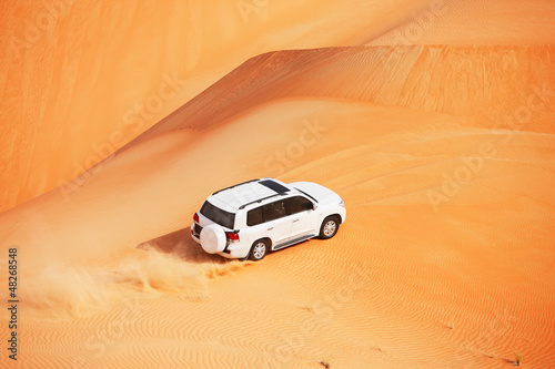 Naklejka ścienna 4 by 4 dune bashing is a popular sport of the Arabian desert