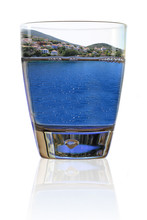 Glass Of Vacation. Greek Island In A Glass Of Water