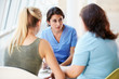 © Monkey Business - Nurse Meeting With Teenage Girl And Mother In Hospital