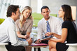 © Monkey Business - Businesspeople With Digital Tablet Having Meeting In Office