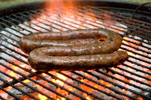 Tradtional South African Braai Barbecue Borewors Sausage On Fire