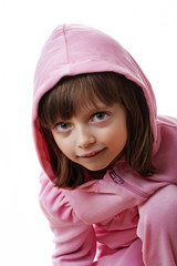 Wall Mural - little girl wearing a pink jacket with hood