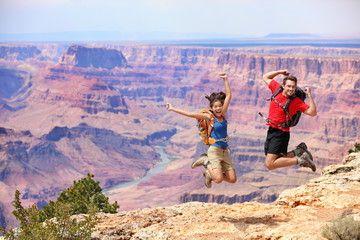 Wall Mural - Happy people jumping in Grand Canyon