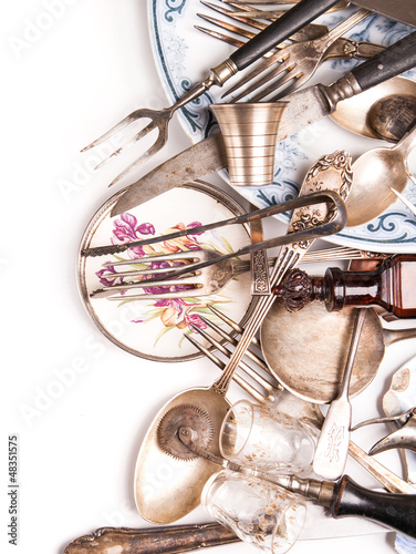 Fototapeta na wymiar Assortment of retro silverware and vintage glass