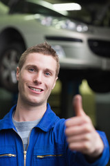 Poster - Handsome car mechanic gesturing thumbs up