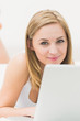 © WavebreakmediaMicro - Portrait of beautiful happy woman using laptop